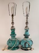 A pair of mid-century Italian Majolica lamps. Turquoise body with white metal fittings. Height to