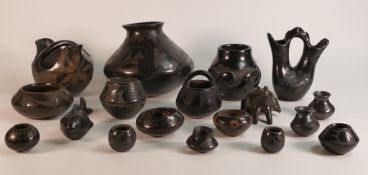 Santa Clara Pueblo Native American black pottery vases of various shapes and sizes - the tallest