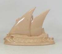 Longwy, model of a sailing boat at sea. Black printed backstamp to base. Height 20cm
