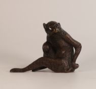 An Oriental Bronze Model of a Seated Monkey. Height: 12cm