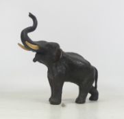 Japanese, Bronze model of an Elephant in salute. Three character mark to underbelly. Height: 20cm