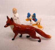 Three ceramic figures to include a Beswick standing fox, Royal Doulton Donald Duck MM3 and Royal