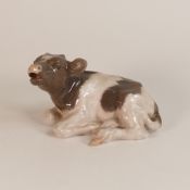 Royal Copenhagen porcelain model of a laying calf, model 1072, h. 11.25cm.
