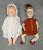 Two Armand Marseille Bisque head dolls with jointed bodies working sleeping eyes , one baby