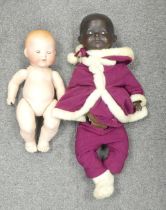 Two Bisque head dolls with jointed bodies and sleeping eyes, one Karl Baumann black baby stamped