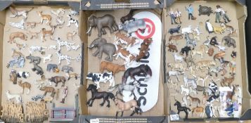 A large collection of Schleich animal figures to include dogs, elephants, lions, cheetahs, cows,