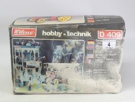 A boxed Wilesco hobby-technik D409 model. Box in poor condition.