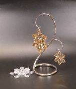 Swarovski Crystal Christmas Snowflake Boxed also a pair of Gold Snowflakes on a silver tone stand,