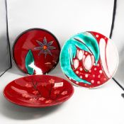 Three Poole Pottery chargers, diameter 26cm, no back stamps (3).