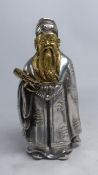 Silver/silver covered figure of Shou Xing holding a scroll, bearing hallmarks and 925 stamped to the