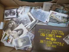 A collection of early 20th century postcards, together with an ammunition case (1 tray).