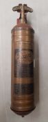 A vintage Pyrene fire extinguisher, with wall mount.