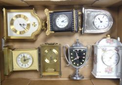 A collection of mainly quartz carriage clocks including brass, marble and ceramic examples (1