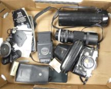 A Canon FT QL 35mm camera with 1:5.6 FL 100mm-200mm zoom lens and Speedlite 199A flash unit. (1