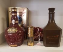 A small brass Florence Colliery miners lamp (height 12cm) together with two empty ceramic whisky