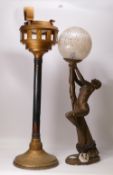 Art Nouveau style lamp featuring a bronzed lady figure with glass lamp shade. Also includes wooden