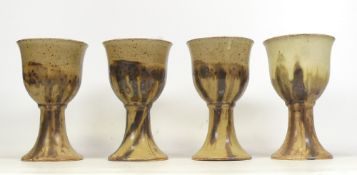 Rhinoss Pottery (Paul Burton) Set of Four Studio Pottery Goblets. In mottled brown glaze.
