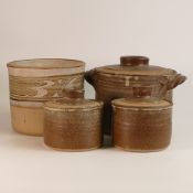 A collection of David Frith studio pottery, including set of Stoneware storage jars with covers