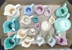 Roddy Ware, a rare green teapot and a collection of coloured milk jugs, a sugar bowl and a small