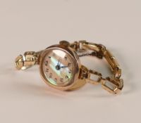 9ct gold gold ladies wrist watch with rolled gold bracelet.