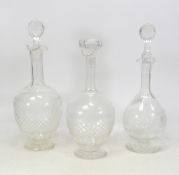 Three Crystal Glass Decanters with assorted stoppers. Height of tallest: 30cm (3)