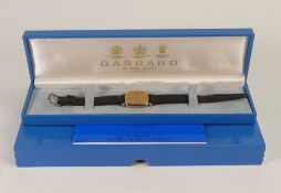 Garrard 9ct gold cased mid size watch, quartz movement, not working. Measures 29mm wide inc. button.