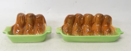 Two Wade Golden Spaniel Puppy ashtrays/pen holders , one three pups, one five pups (2)