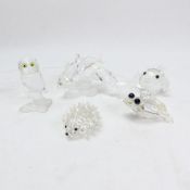 A collection of small Swarovski Crystal figurines to include a Frog, Owl, Three South Sea Fish,