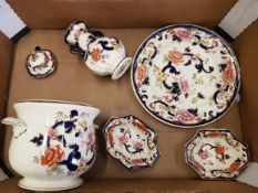 Framed behind glass a painting depicting a Lyrebird against a black background, signed with initials