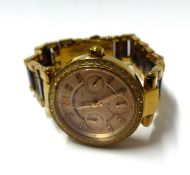 Collection of four ladies wrist watches; a Gucci gold plated 1900L bangle watch, a Michael Kors