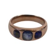 yellow metal ring set with three blue stones, size P, electronically tested to be 6.9ct, 5.6g