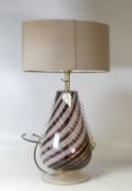 A Murano glass table lamp decorated in red, yellow and white swirl pattern. (H: 48cm with shade)