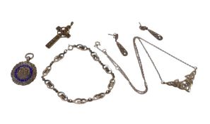 A Silver pendant and chain with matching earrings and bracelet, silver football pendant together