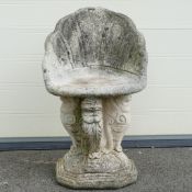 A large reconstituted stone garden seat, with quatrefoil base. Collection or courier only. (H: