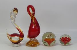 A selection of Murano style red/amber tall swans together with two paperweights decorated inside