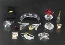A collection of boxed Swarovski renewal gift crystal items including Blue Tulip 606546, Yellow Tulip