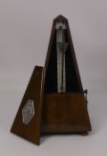 A Maelzel Paquet cased metronome. (H: 23cm)