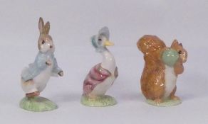 Three Royal Albert Beatrix Potter figures, Peter Rabbit, Jemima Puddleduck and Squirrel Nutkin,