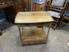 Golden Oak barley twist side table/tea trolley with 4 small drawers raised on metal castors 61cm D X