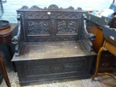 Dark Oak carved monk's bench with lion head arm rests 107cm W x 104cm H x 52cm D