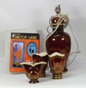 A collection of Carlton Ware Rouge Royale to include three decorative vases, large table lamp and