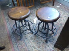 A pair of oak-topped metal-based machinist's stools 35cm in diameter (2)
