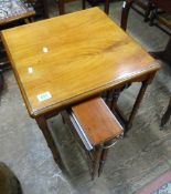 Mahogany side table raised on stretchered castor supports, housing two metamorphic occasional tables