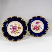 Caverswall shaped gilded cabinet plates, hand painted with flowers, by M Grant. Max D.25cm