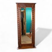 Edwardian Oak carved rectangular mirror with bevelled edge. H:142cm x W:59cm. COURIER OR