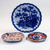 A collection of Japanese porcelain including a shaped charger decorated with birds and two Imari