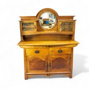 Oak Arts & Crafts style two door sideboard with mirrored back, H:185cm x W:152cm x D:53cm. COURIER