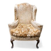 Early 20th century shaped upholstered Armchair on Queen Anne supports. COURIER OR COLLECTION ONLY