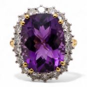 18ct yellow Gold ring set large amethyst (16mm x 12mm) with diamond surround. Ring size O, but