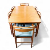 Mid century modern Teak extending dining table and set of six matching dining chairs, un-extended